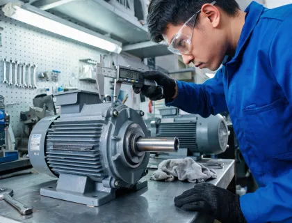 technician measuring motor shaft